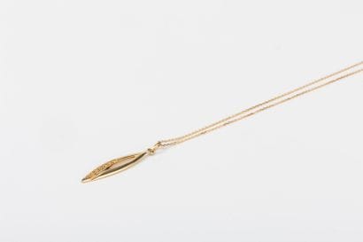 Yellow gold forcat chain holding a navette...