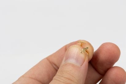 Pair of earrings in yellow gold representing...