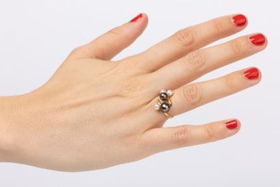 Yellow gold ring set with white cultured...