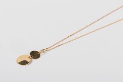 Yellow gold forcat chain with a pendant holding...