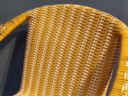 Yellow and white woven plastic armchair,...