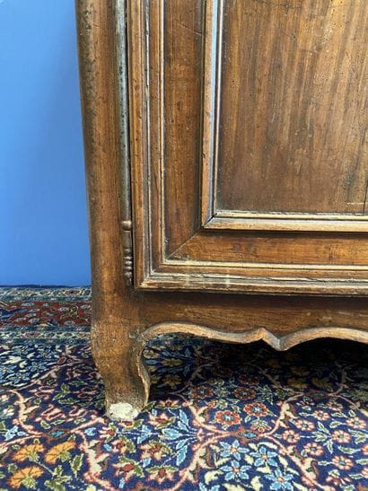 Moulded natural wood sideboard opening to...