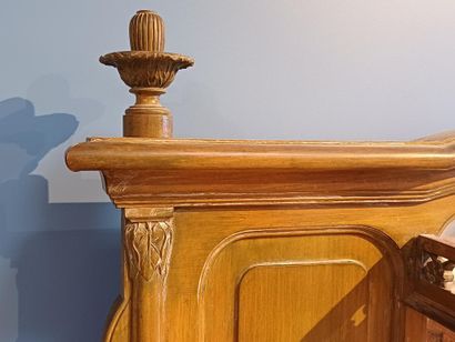 Wooden sideboard carved with flowers, the...