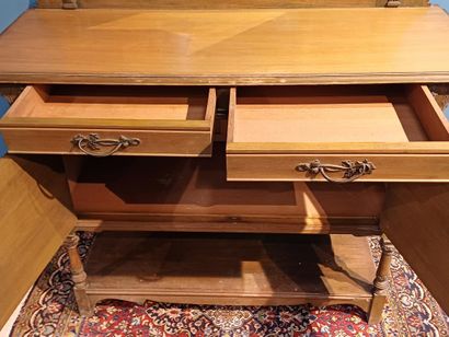 Wooden sideboard carved with flowers, the...