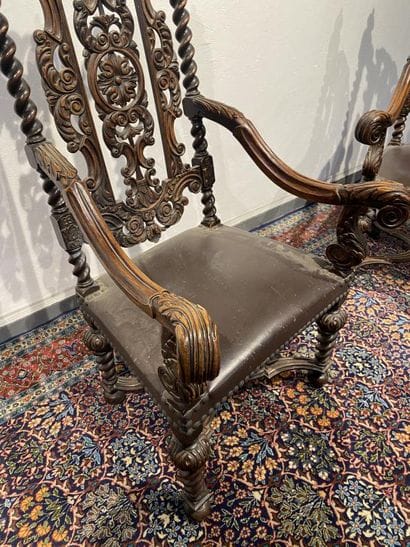 Pair of walnut armchairs, richly carved with...