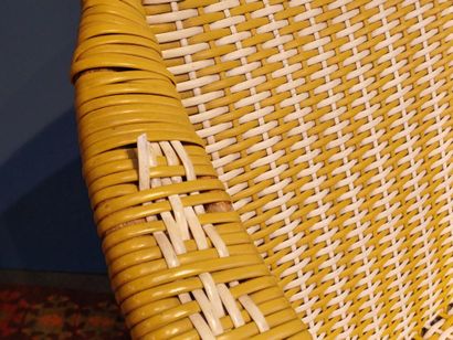 Yellow and white woven plastic armchair,...