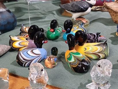 Collection of figurines representing birds...