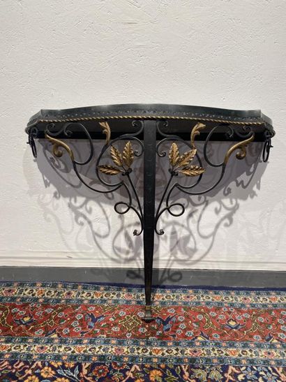 Partially gilded wrought-iron console decorated...