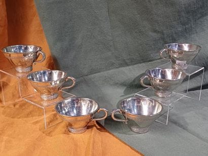 Suite of six bright pewter cider bowls, decorated...