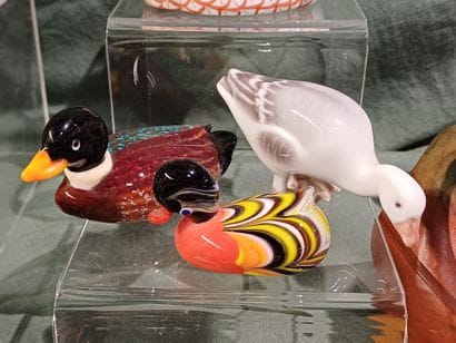 Collection of figurines representing birds...
