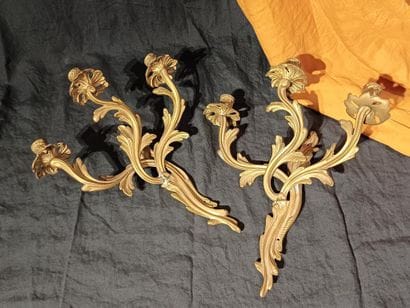 Pair of three-light sconces in chased and...
