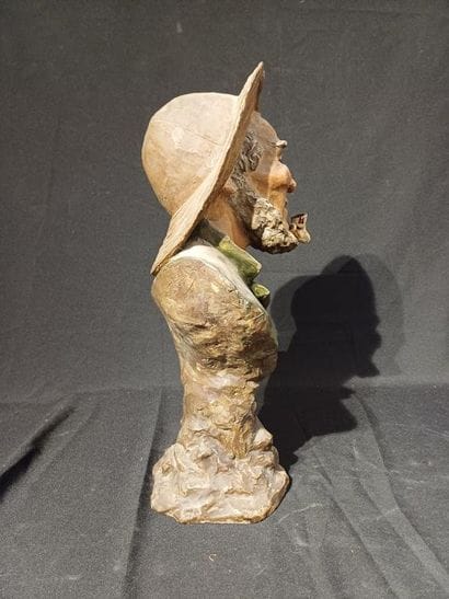 Polychrome patinated plaster bust of a man...