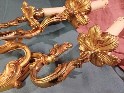 Pair of three-light sconces in chased and...