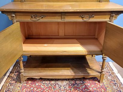 Wooden sideboard carved with flowers, the...