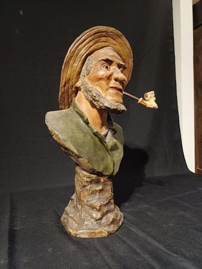 Polychrome patinated plaster bust of a man...