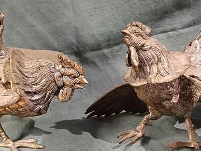 Two roosters facing each other with outstretched...