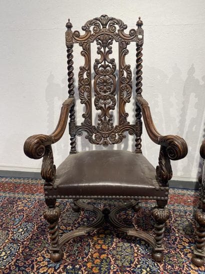 Pair of walnut armchairs, richly carved with...