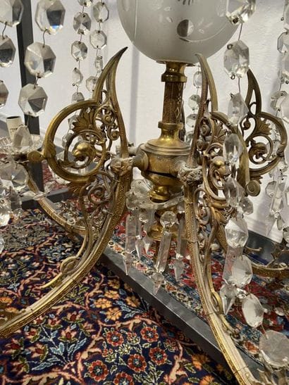 Brass chandelier with five foliate scrolled...
