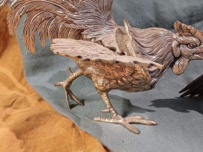Two roosters facing each other with outstretched...