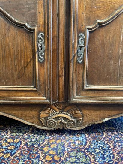 Moulded natural wood sideboard opening to...