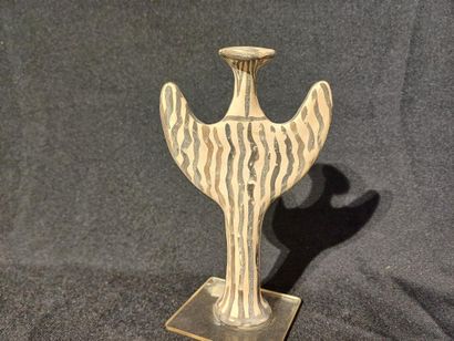 Terracotta statuette with painted decoration...