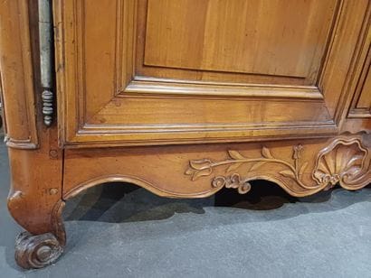 Large cabinet in molded and carved cherrywood,...