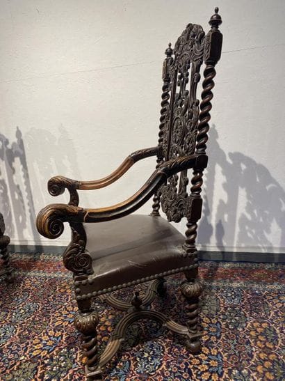 Pair of walnut armchairs, richly carved with...