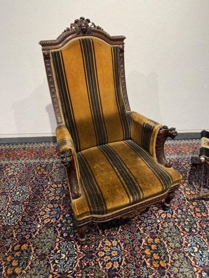 Oak armchair with carved Indian head, lion's...