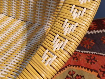 Yellow and white woven plastic armchair,...