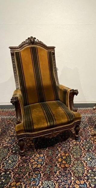 Oak armchair with carved Indian head, lion's...