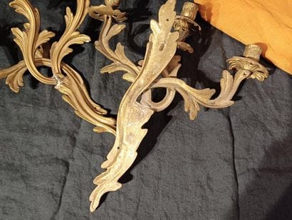 Pair of three-light sconces in chased and...