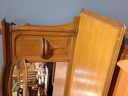 Wooden sideboard carved with flowers, the...