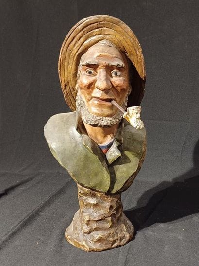 Polychrome patinated plaster bust of a man...