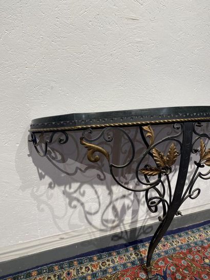 Partially gilded wrought-iron console decorated...