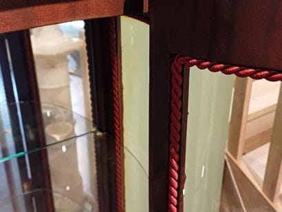 A three-sided-glazed, curved display case...