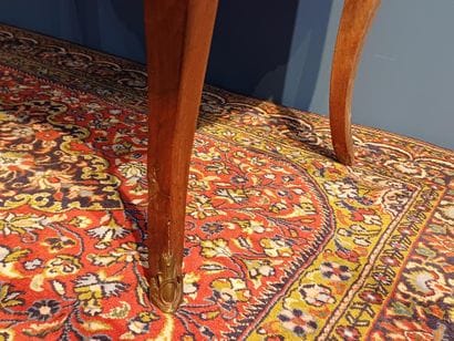 Walnut sloping desk opening to a flap revealing...