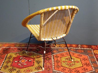 Yellow and white woven plastic armchair,...