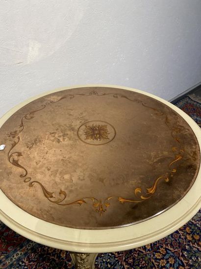Round table in molded, carved and cream and...