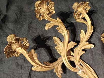 Pair of three-light sconces in chased and...