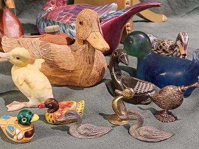 Collection of figurines representing birds...