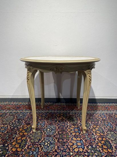 Round table in molded, carved and cream and...