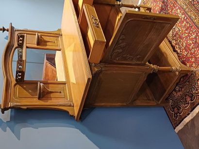 Wooden sideboard carved with flowers, the...