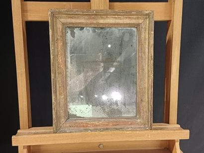 Small mirror in wood and gilded stucco. 
19th...