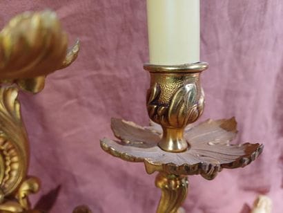Pair of three-light sconces in chased and...