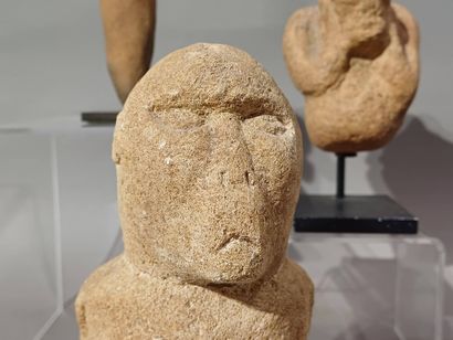 Lot of four West African objects: a seated...