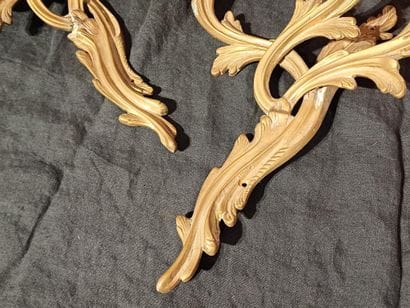 Pair of three-light sconces in chased and...