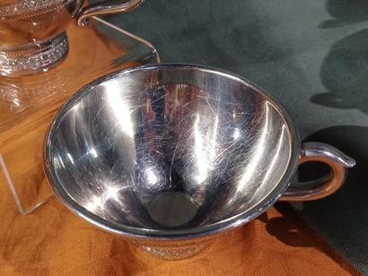 Suite of six bright pewter cider bowls, decorated...