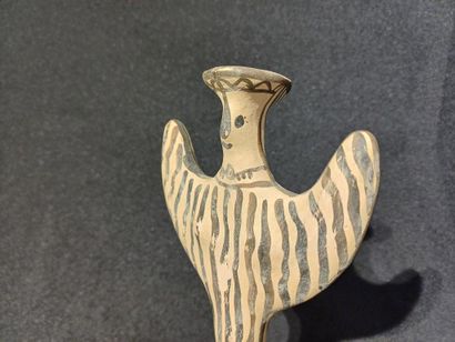 Terracotta statuette with painted decoration...