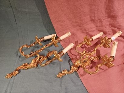 Pair of three-light sconces in chased and...