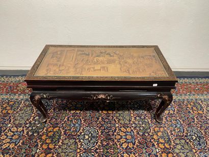 Lacquered wood coffee table with top carved...